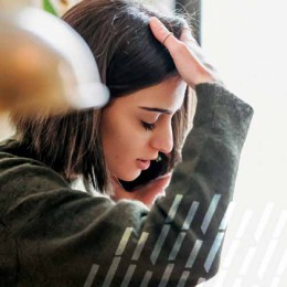 Upset woman talking on her phone.