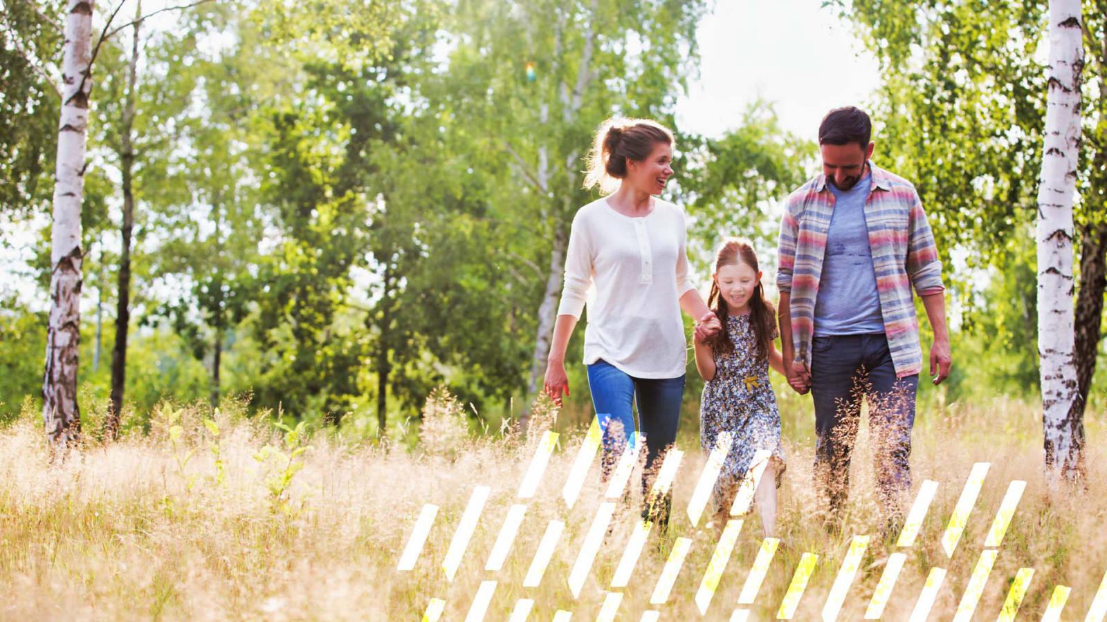 Family walking through a field
