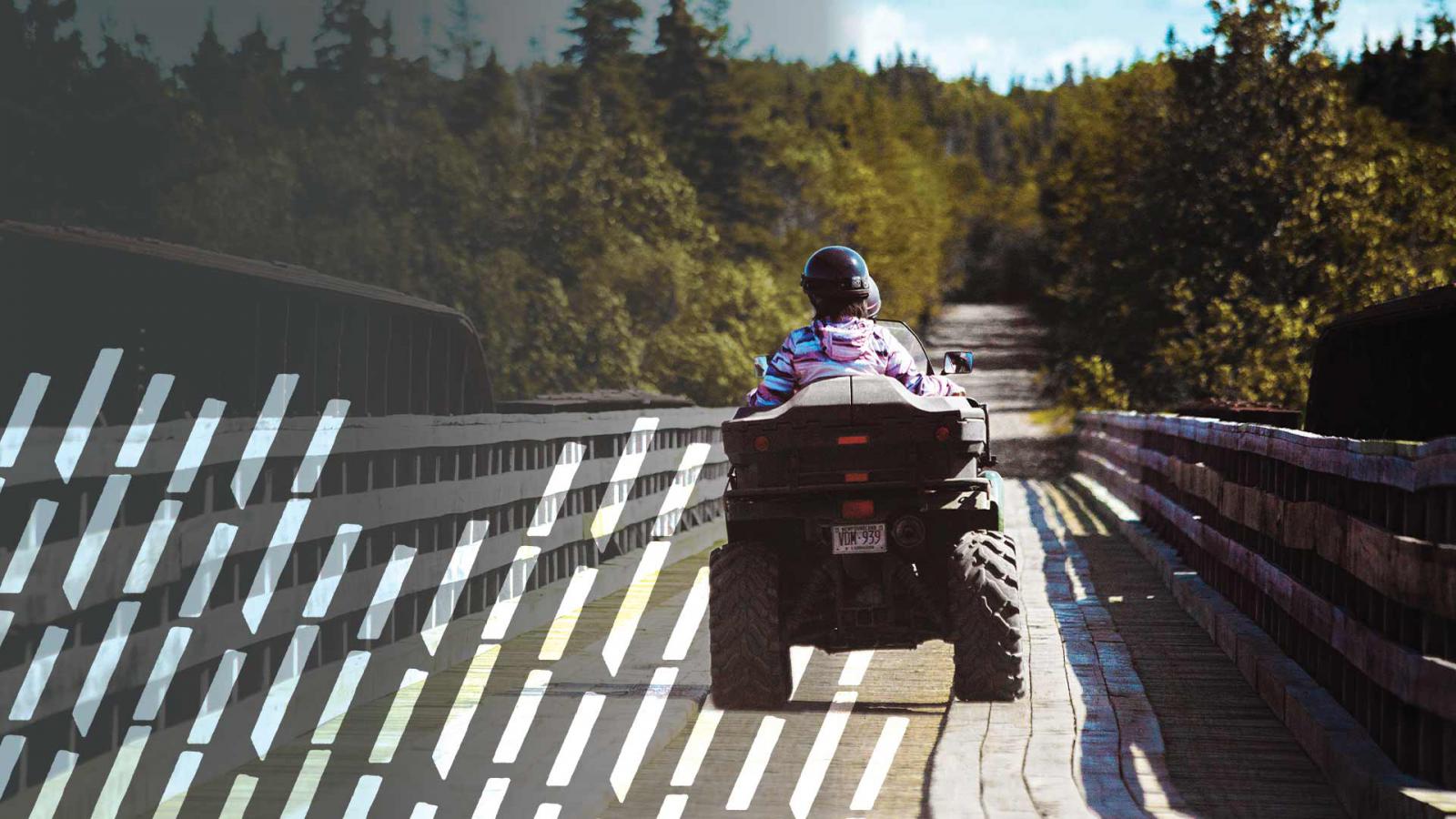 Couple riding a four wheeler