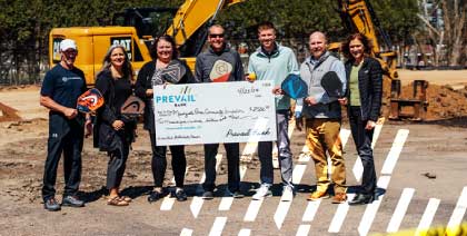Prevail Bank in Marshfield presenting a donation check